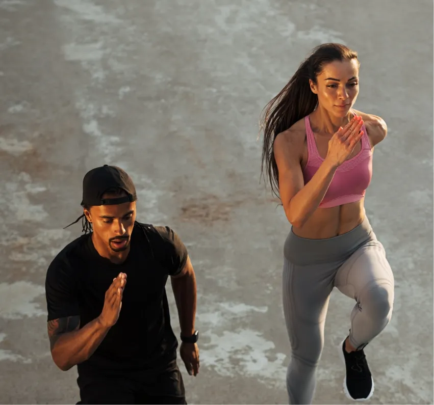 high-angle-of-two-athletes-running-together-on-the-2025-03-09-22-05-23-utc